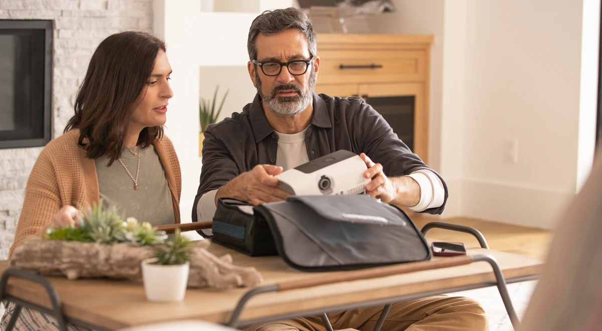 Couple unboxing a new CPAP machine