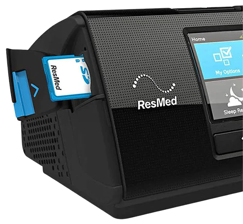 Image of SD Card being inserted t oa CPAP machine